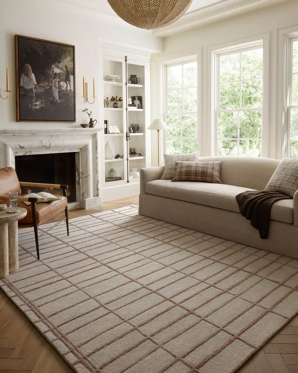 Chris Loves Julia × Loloi Bradley Rug in Rose/Blush - styled with a neutral sofa