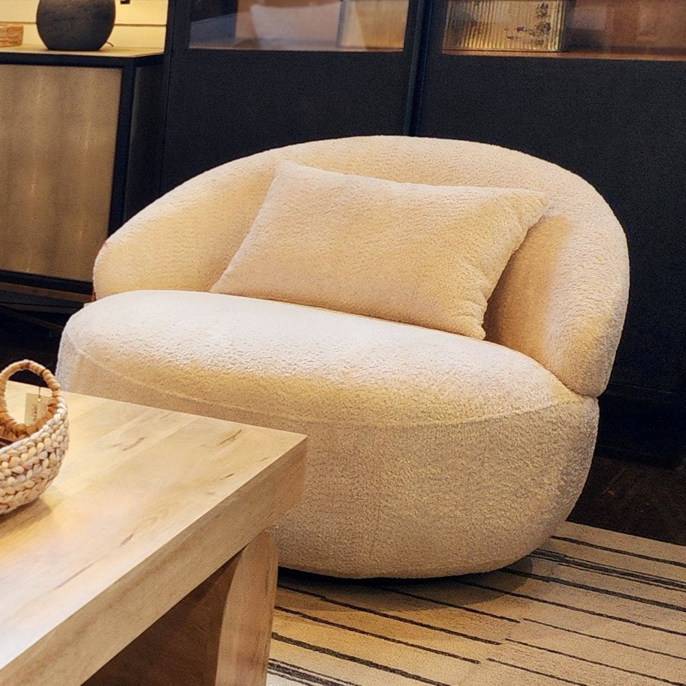 Crescent swivel chair in utopia sand -shown here in the City Home showroom