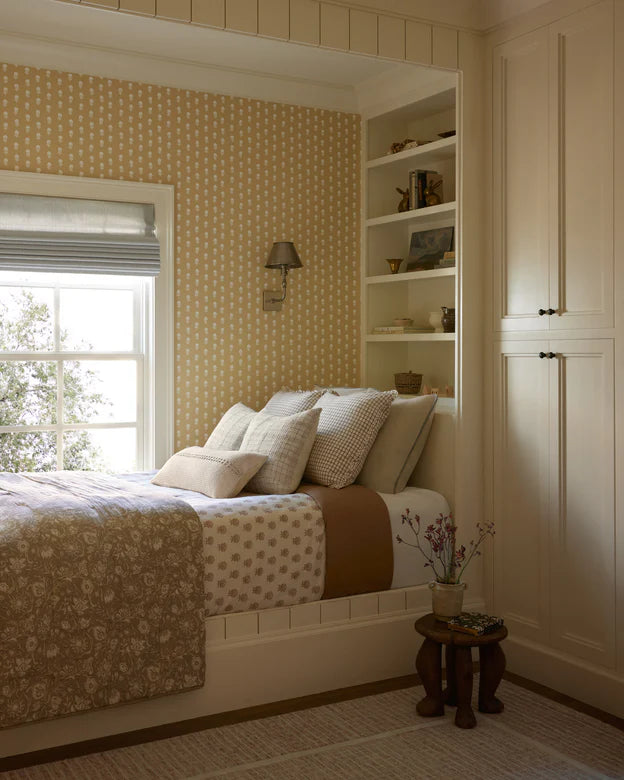 Dinah Pillow - styled on a bed with other neutral throws