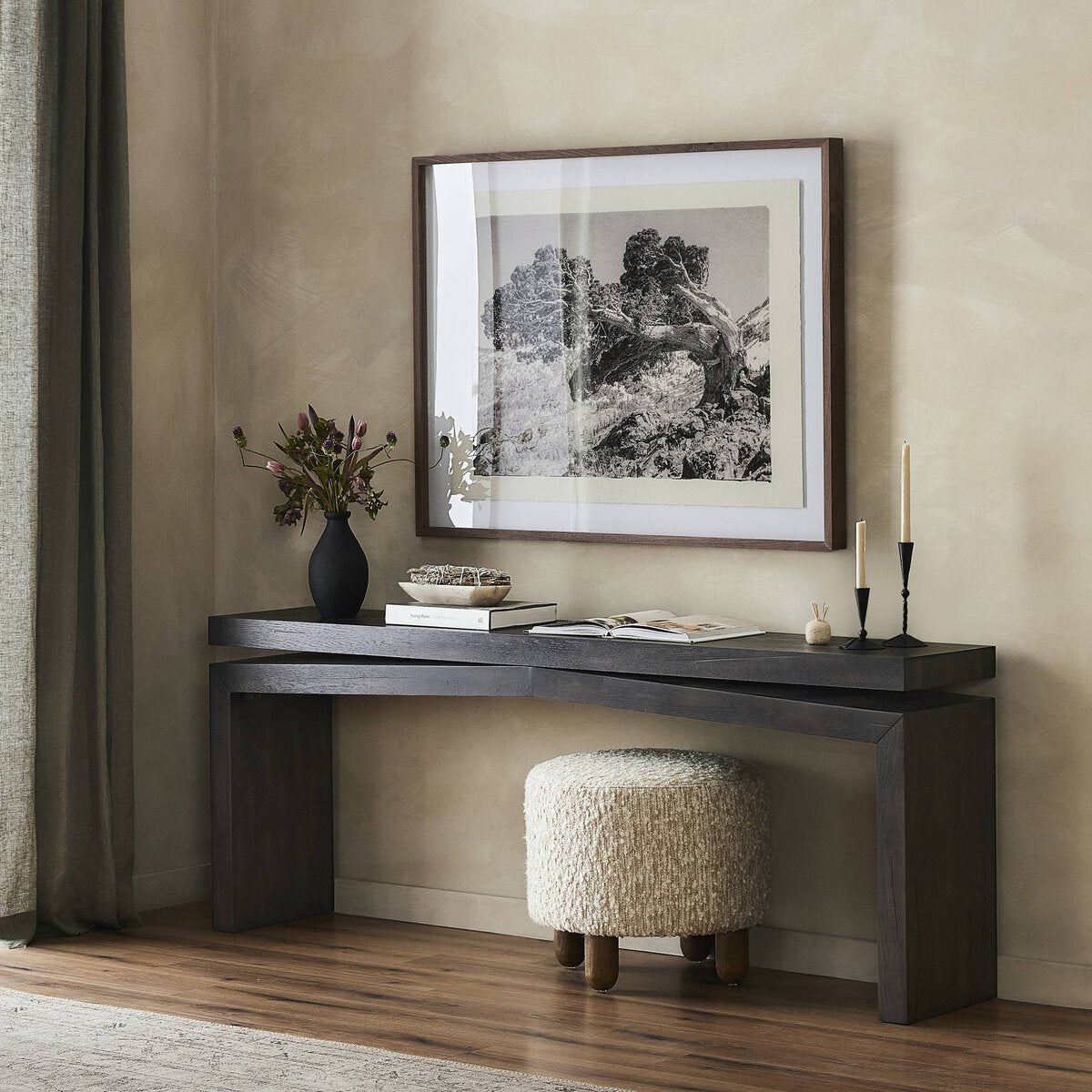 Matthes Console Table - smoked black, styled with black and white artwork