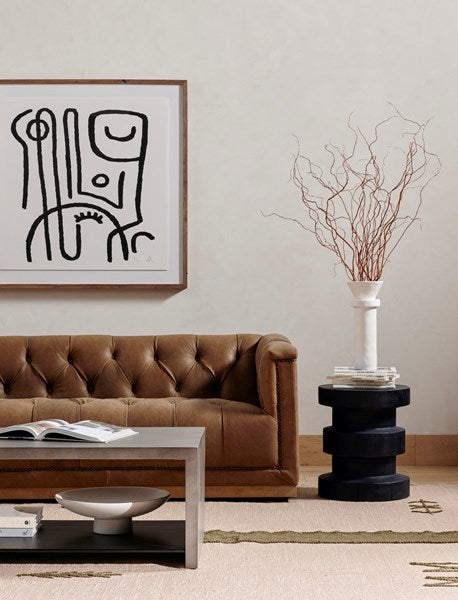 Inez end table in black pine styled in a living room