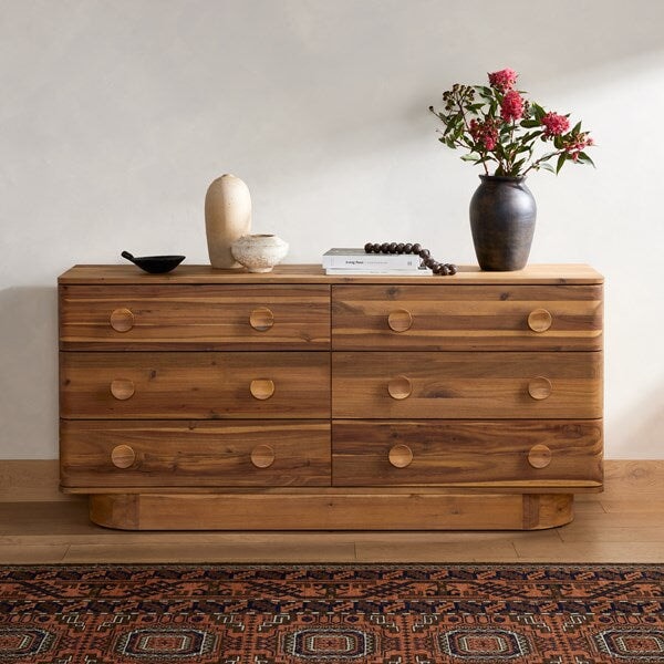 Mallory 6 Drawer Dresser in light acacia styled with textured vases and books