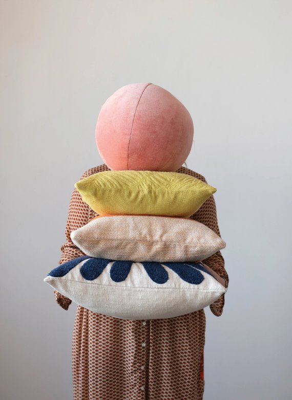 Cotton Velvet Orb Pillow: The orb pillow is a great way to play with shapes in your home! Adding a cool modern touch with the soft velvet texture and the delightful shade of salmon pink.