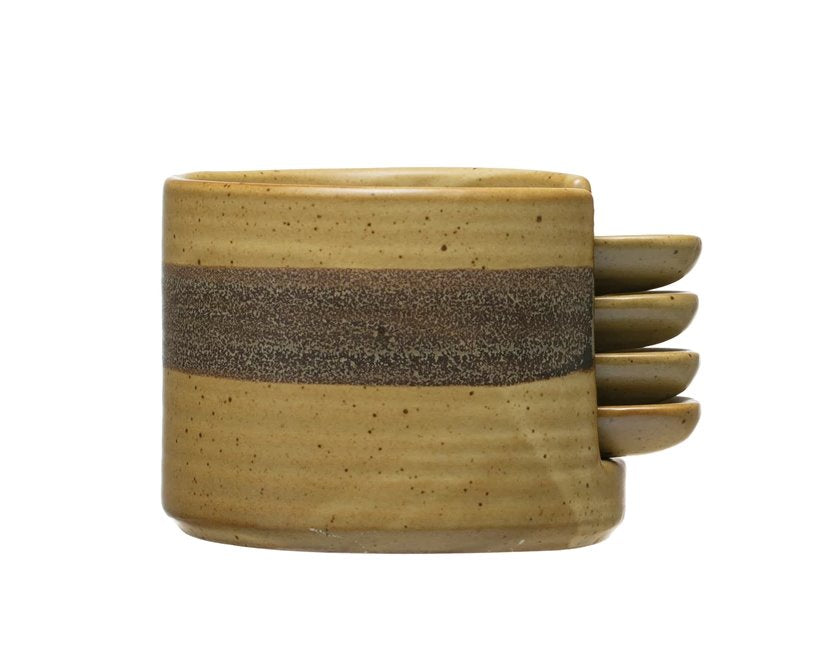 Tapa Plates w/ Holder: When decorative and functional meet! Black and brown spectacled reactive glaze ceramic plates w/ holder to beautifully display appetizers and snacks. This holder stores four mini circular plates with a handle so it is easier for you and your guests to move around while snacking.