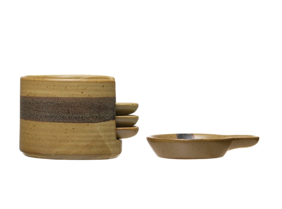 Tapa Plates w/ Holder: When decorative and functional meet! Black and brown spectacled reactive glaze ceramic plates w/ holder to beautifully display appetizers and snacks. This holder stores four mini circular plates with a handle so it is easier for you and your guests to move around while snacking.