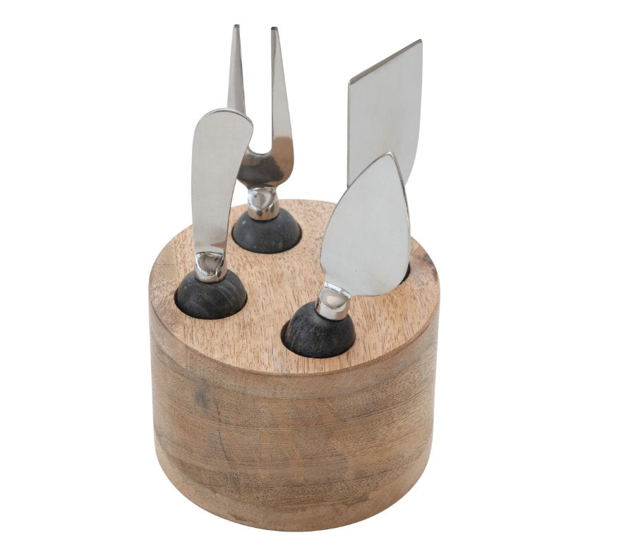 Wood Stand Stainless Steal Cheese Marble Servers: The ultimate serving utensils to use for your beautifully crafted cheese board. This light round mango wood stand holds four different servers with a black marble handle for different assortment of cheeses.