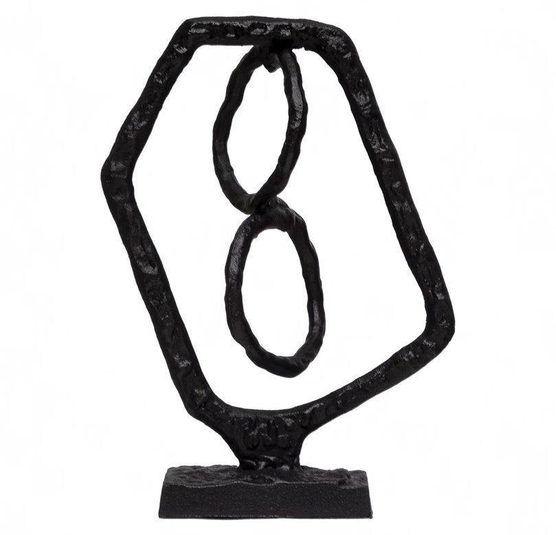 Cast Iron Abstract Decor Object: Bring a piece of abstract art into your home with this cast iron sculpture. This decor object adds an element of design to a table top, bookshelf, or any space that needs a little something extra.