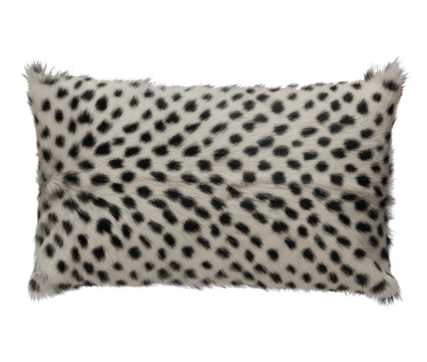 20" x 12" Goat Fur Lumbar Pillow w/ Printed Spots: Add the element of texture to your home with this lumbar fur pillow with a timeless black/white spotted print that goes with your ever-changing style.