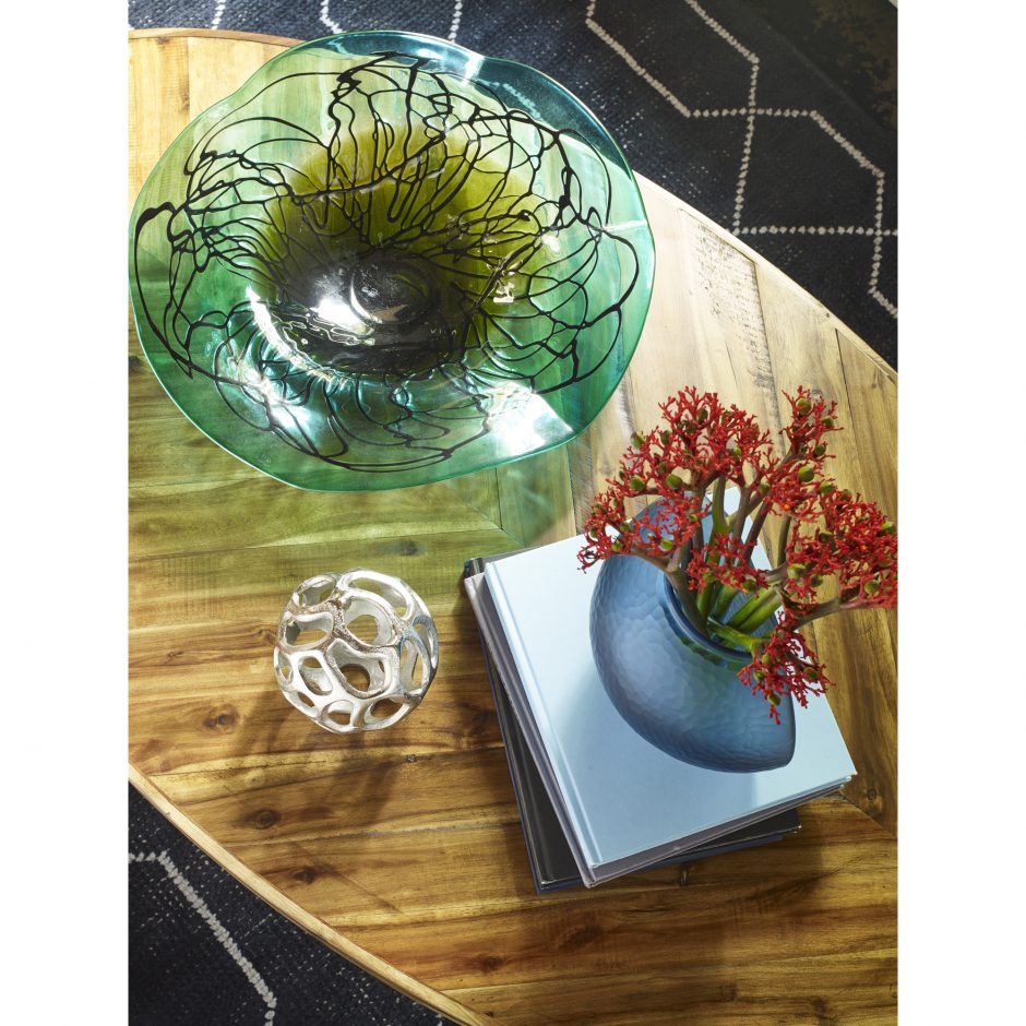 Parq Oval Coffee Table styled with decorative objects