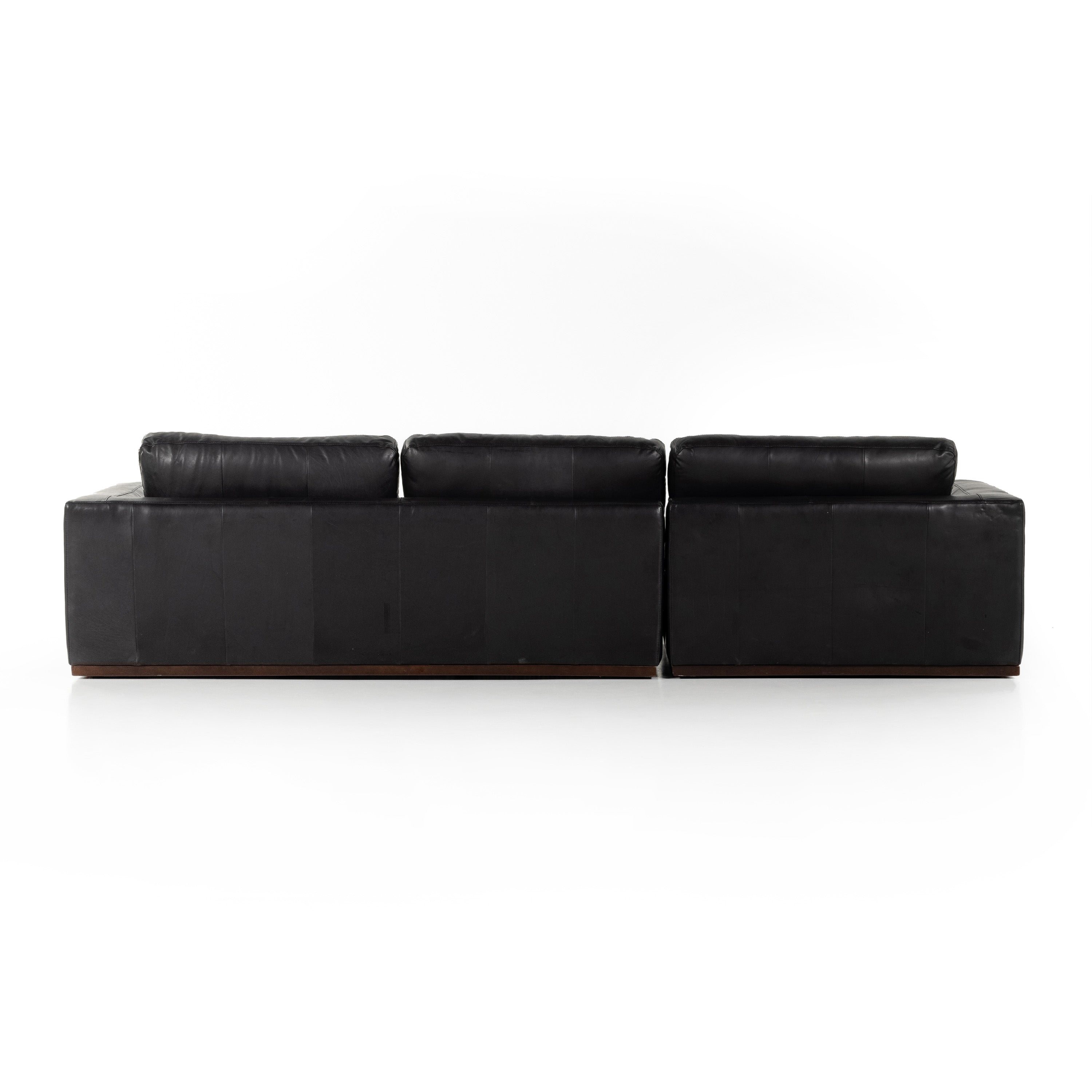 Colt Sectional in heirloom black leather back