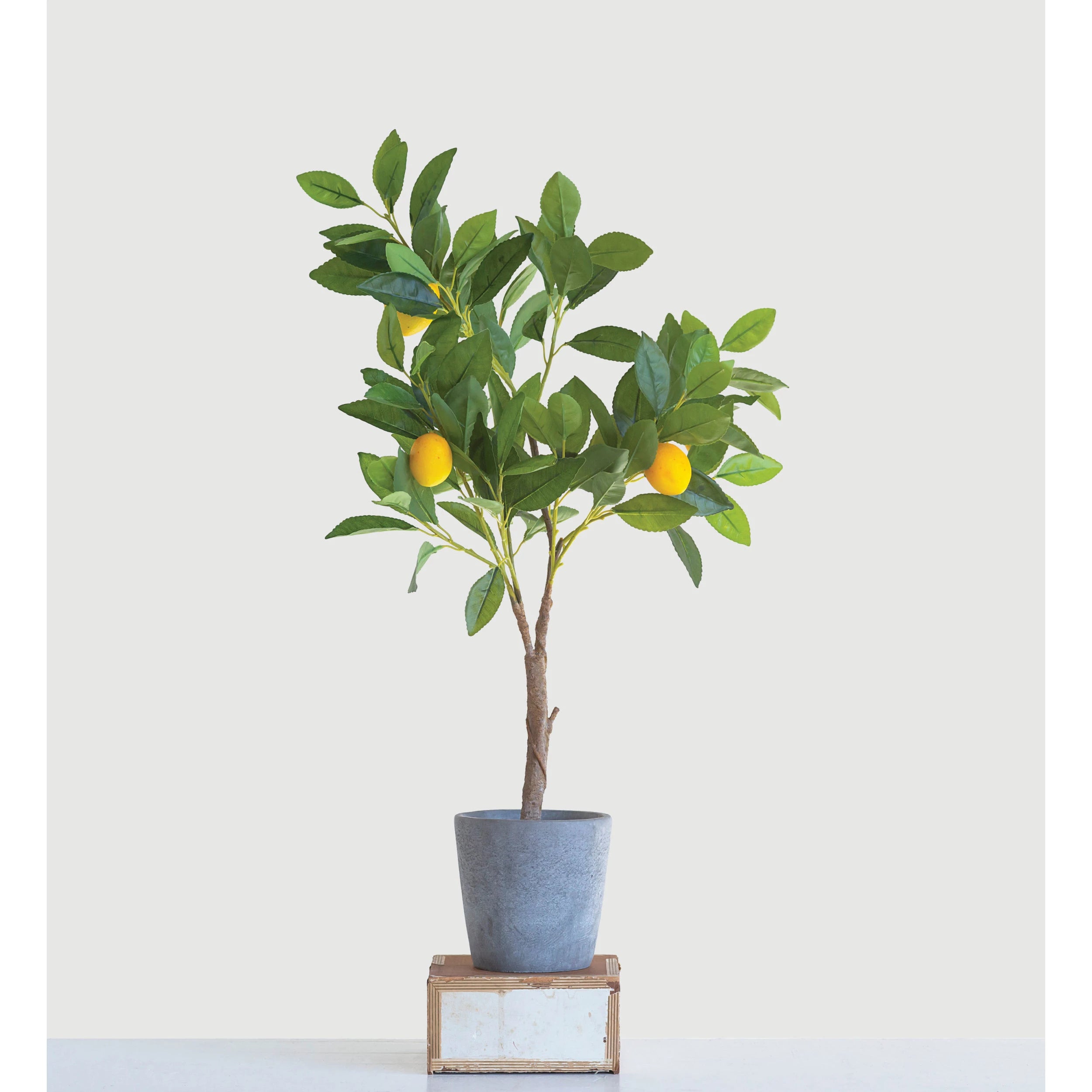Faux lemon tree in cement pot