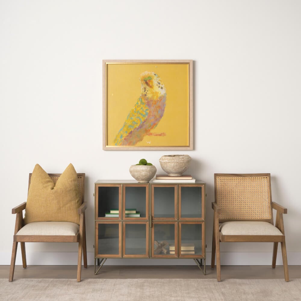 Pop Birds I Framed Wall Art - styled above a cabinet and chairs