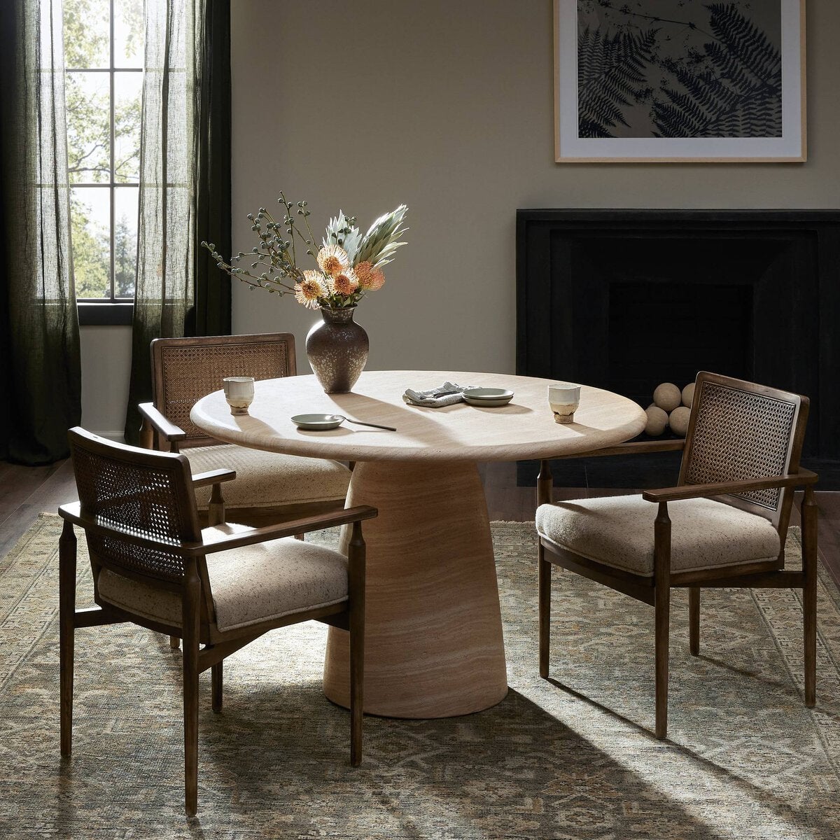 Janice Dining Table - styled in a dining room with rattan chairs
