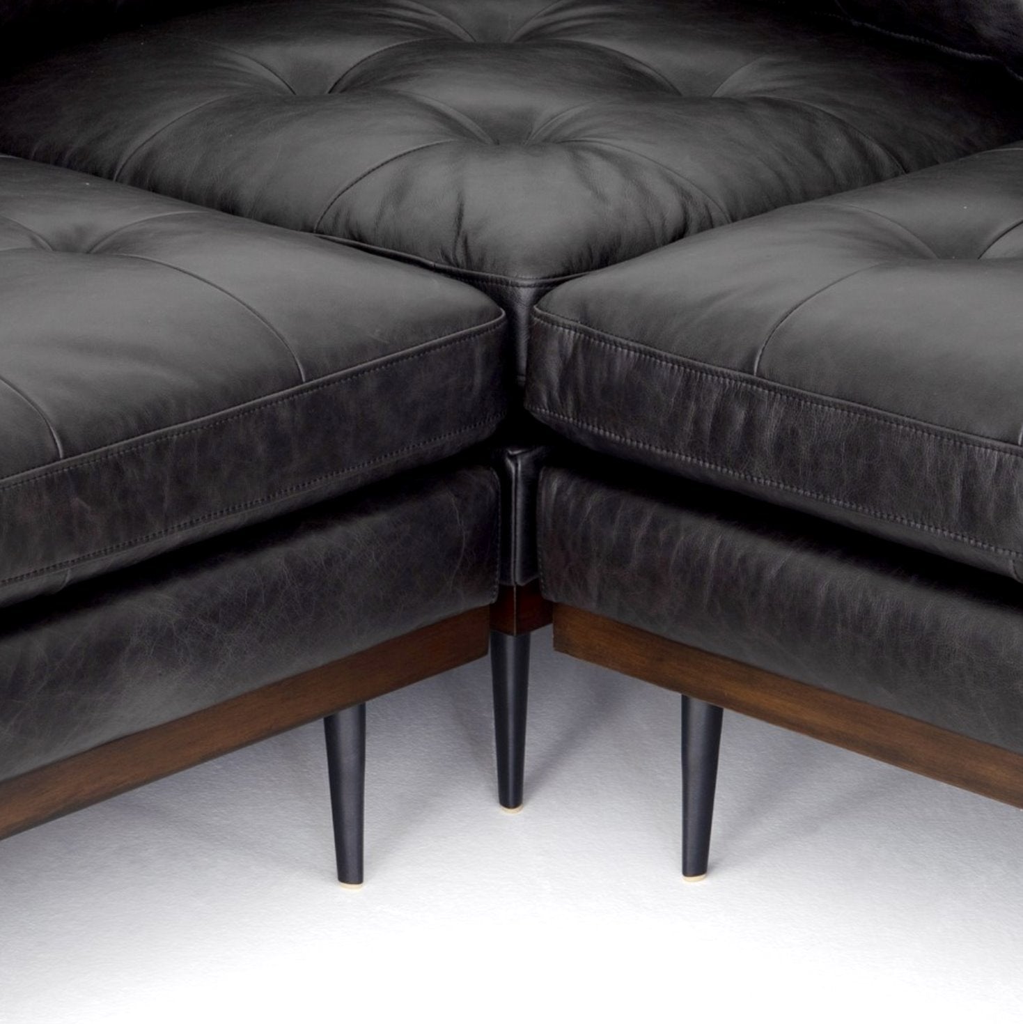 Lexi 3-Piece Leather Sectional in Sonoma Black: Up-Close Tapered Legs View