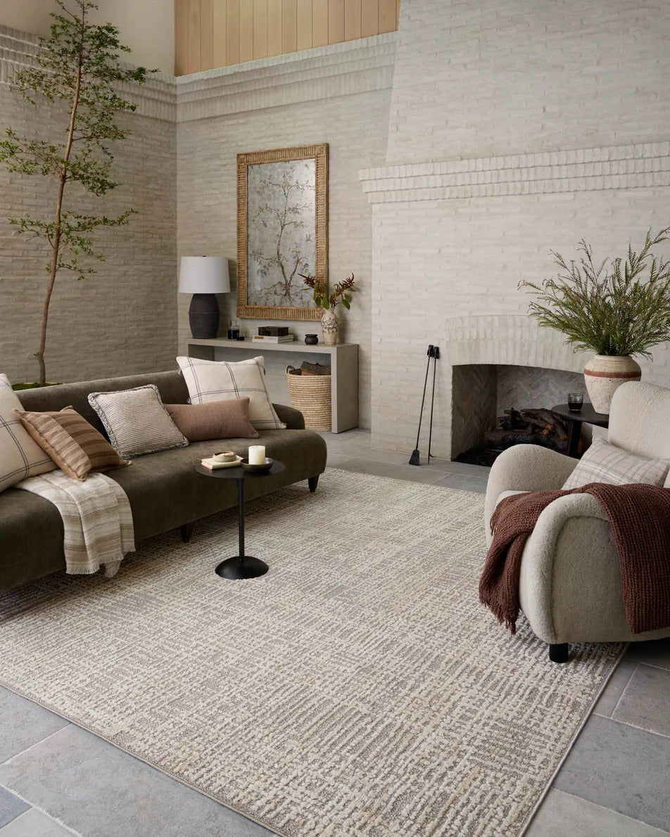 Amber Lewis × Loloi Bexley Rug in Natural/Dove - styled with a sofa and chair