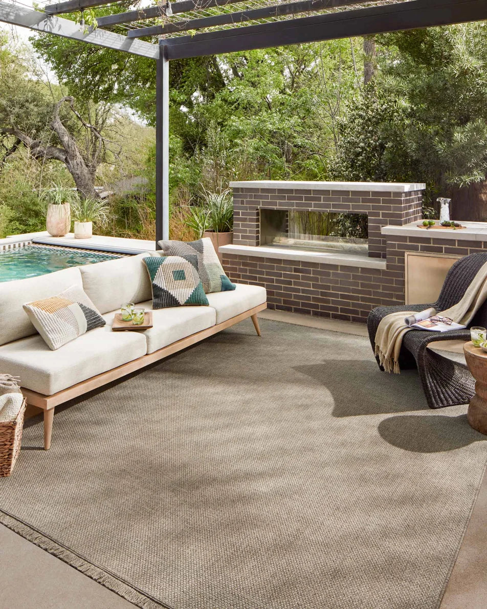 Dawn Indoor/Outdoor Rug in Natural styled with an outdoor sofa