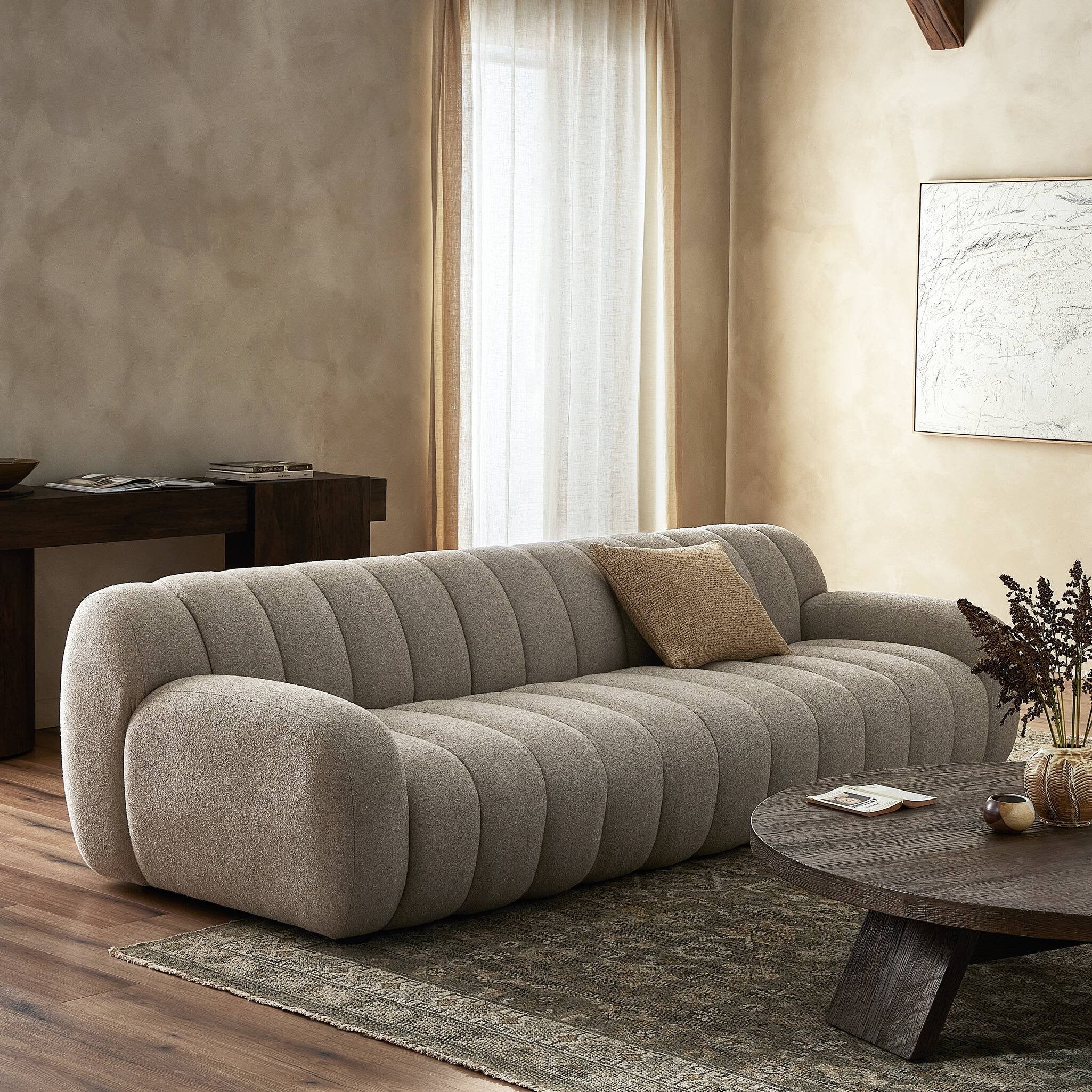 Carina Sofa - styled with a rug and coffee table