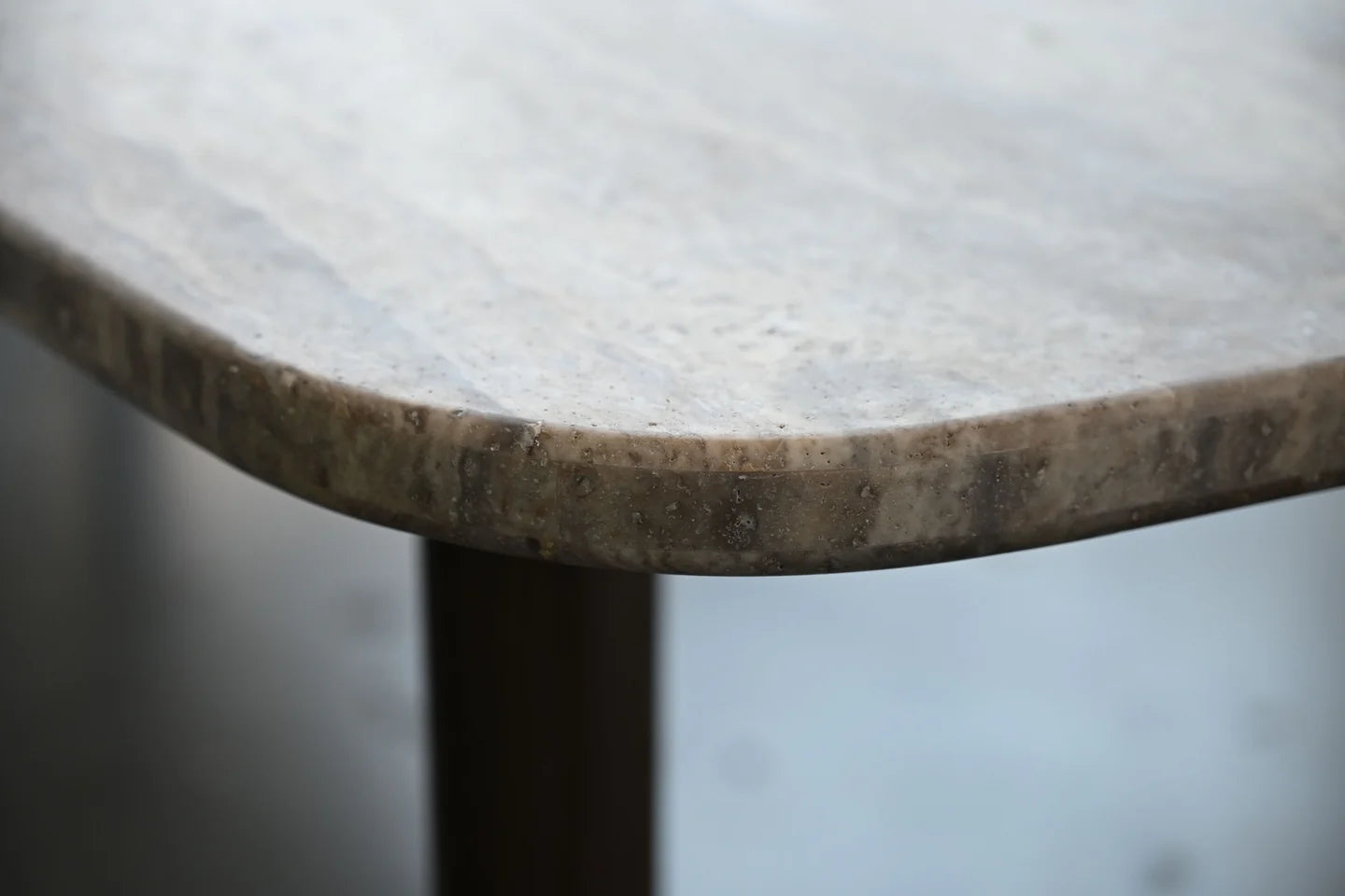 Shoku Dining Table - detail view of travertine marble