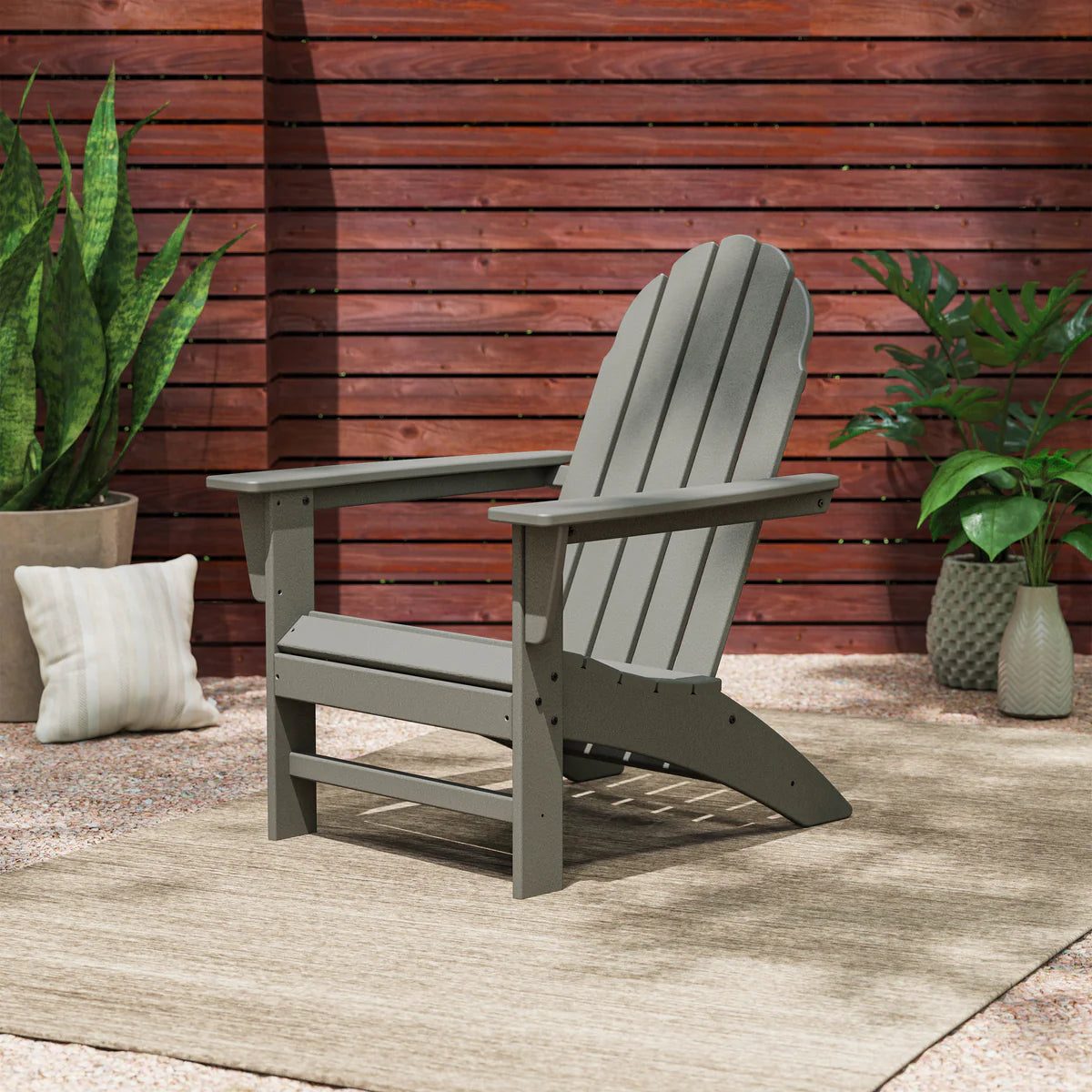Vineyard Adirondack Chair - shown styled on a patio with plants