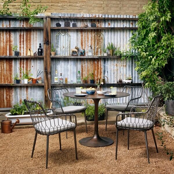 Simone Bistro Table - styled outdoors with 4 chairs