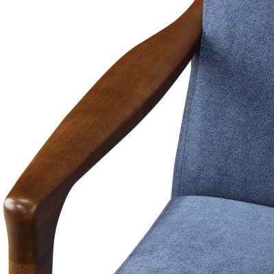 Nicholas Armchair in studio dark blue arm detail