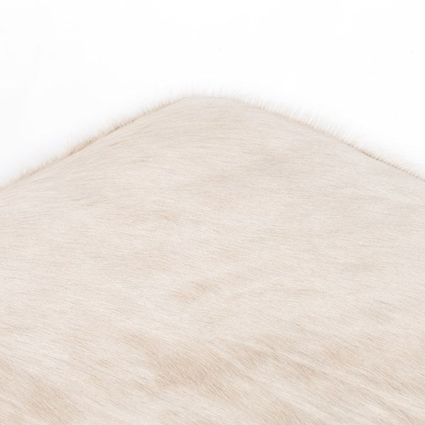Oaklynn Ottoman in buff hair on hide corner detail