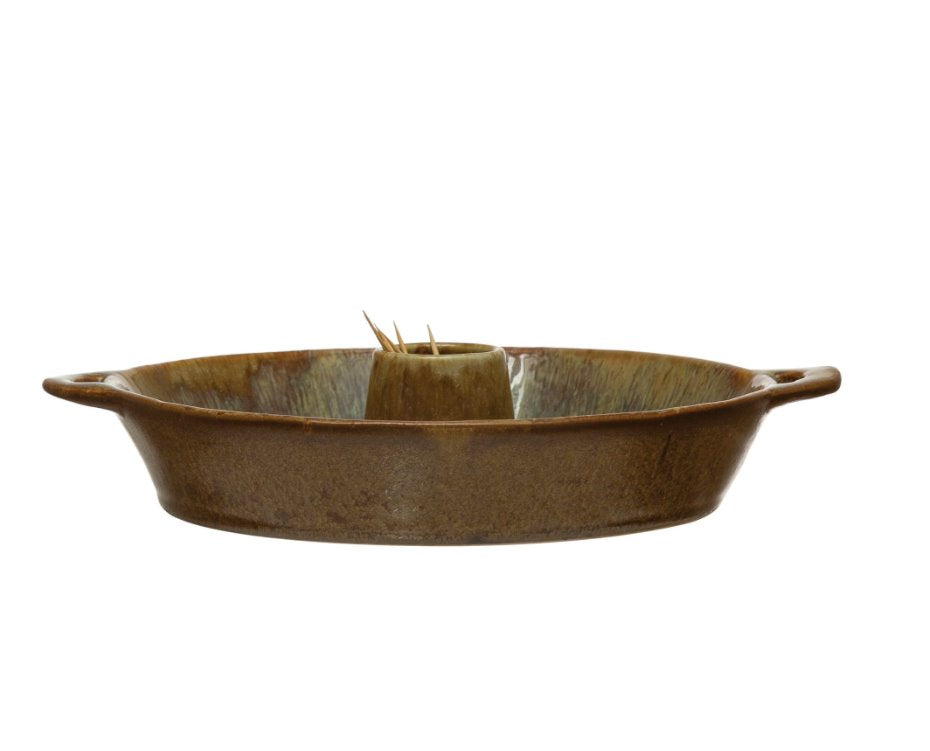 Stoneware Toothpick Holder: This dish is perfect for the person who loves to throw dinner parties. A lovely circular brown container with side handles that has a toothpick holder in the center;  making the reactive glaze stoneware functional for serving small finger foods at your next party!