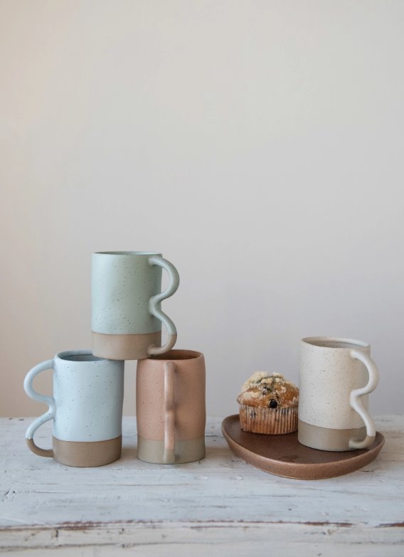 Matte Speckled Stoneware Squiggle Handle Mug: Functionality meets aesthetic with these beautiful stoneware mugs. The matte color scheme with the subtle specks and the squiggle handle makes these mugs a must-have in the kitchen.
