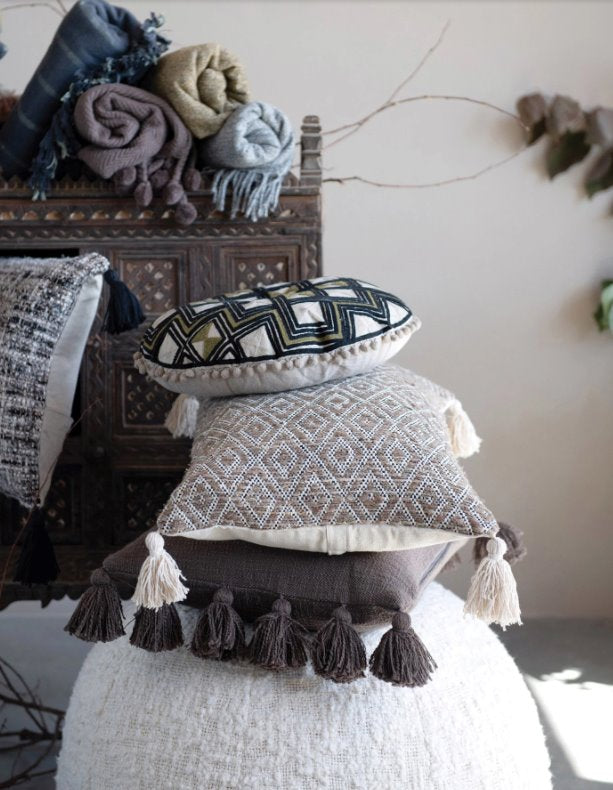 Embroidered Round Cotton Pillow with Pom Poms:  Elevate your space with this cute textured multi-colored pattern pillow with pom poms along the edge. This pillow brings both comfort and unique style to your home.